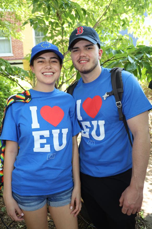 Two people in "I Heart EU" T-shirts pose for the camera.