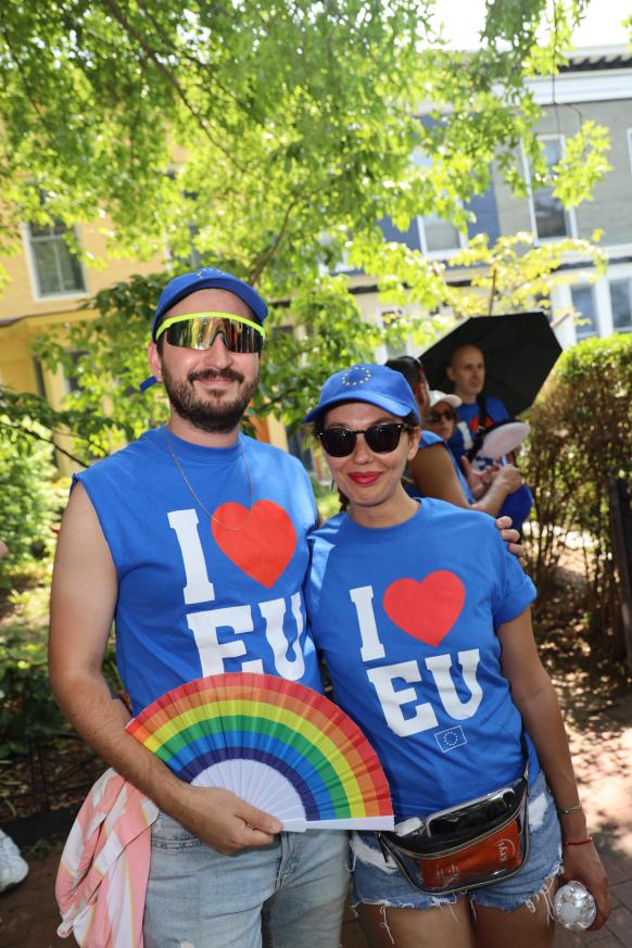 Two people in "I Heart EU" T-shirts pose for the camera.