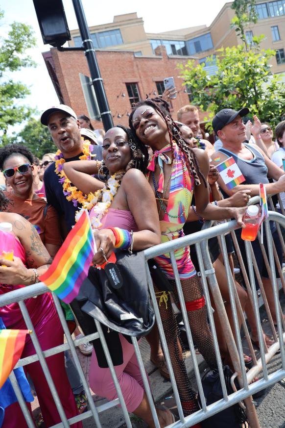 Members of the crowd watching the Capital Pride Parade.