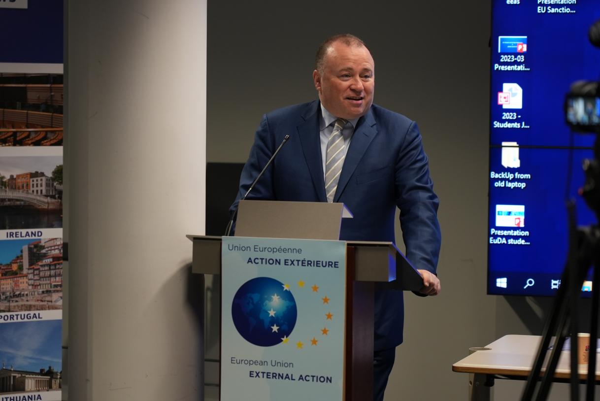 Man talking into a lectern