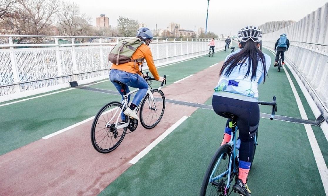 Cyclists crossing a bridge