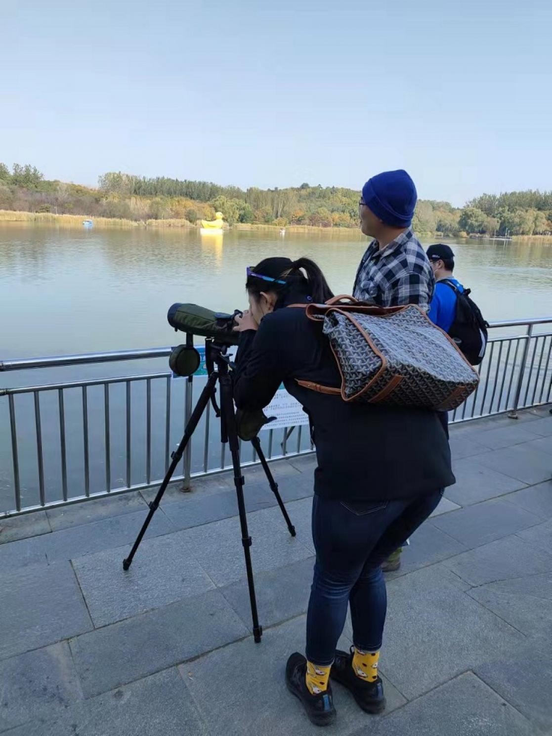 Woman taking photos with a tripod