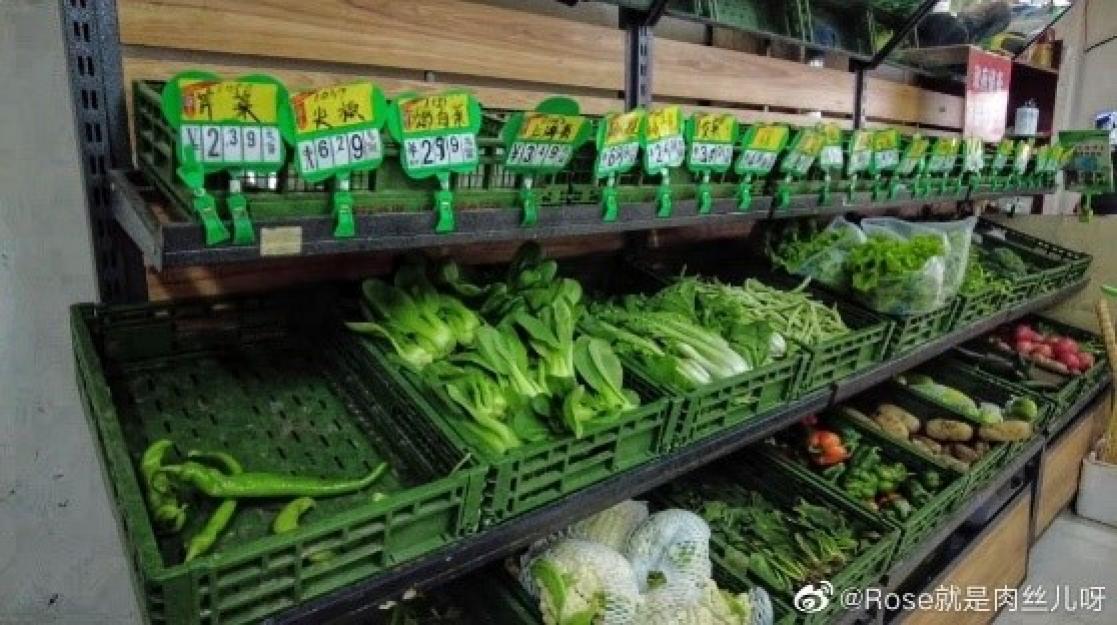 Green plastic boxes with fruits and vegetables