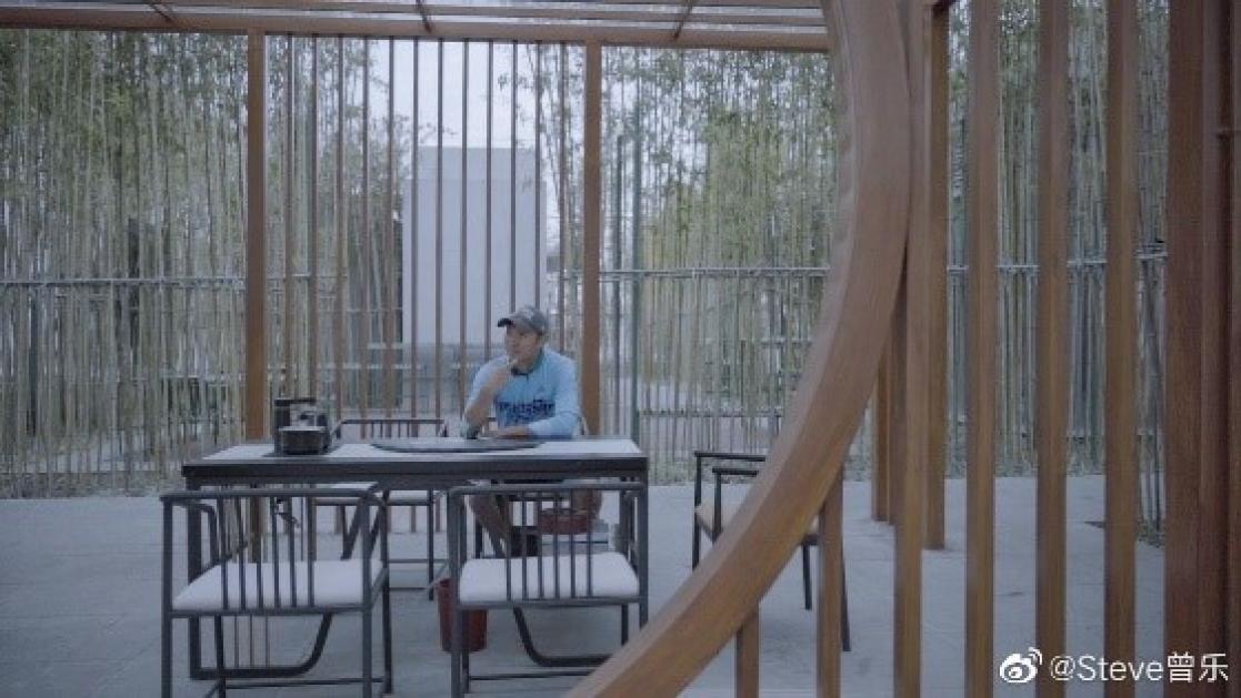 Man sitting at a table on a terrace