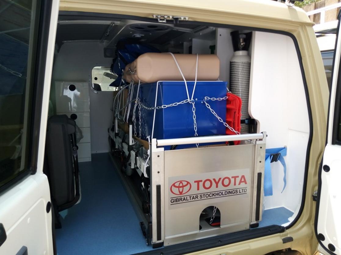 Ambulance with boxes on the luggage compartment