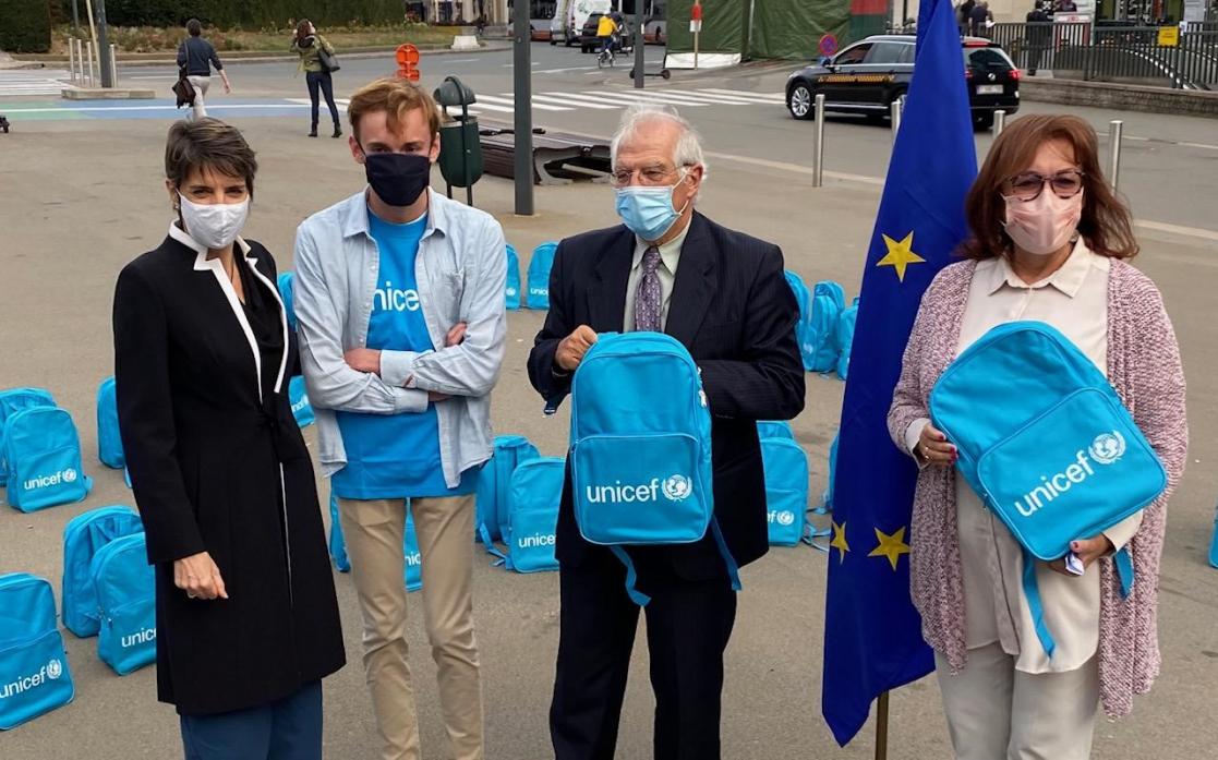 Borrell and three more people with Unicef bags