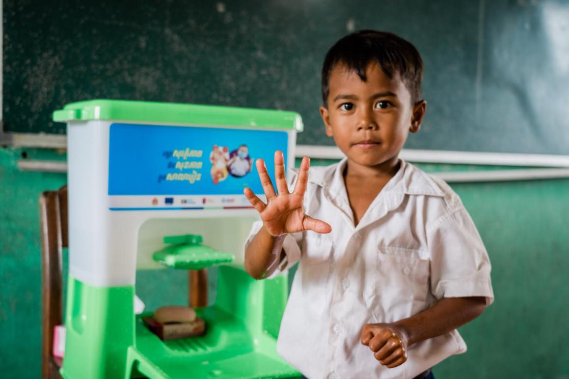 Cambodia child saying hi to the camera