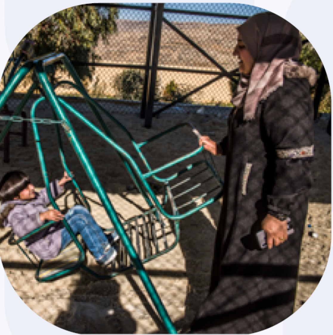 Woman playing with a kid in the park