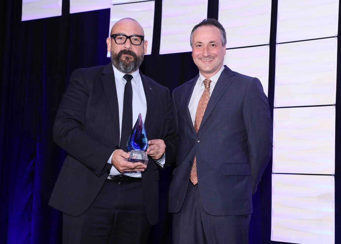 Director of the Wilson Center's Latin America Program, Benjamin Gedan , handiing over the Wilson Center Award to Jordi Cañas, the Chief Observer to the Electoral Obersation Mission to Guatemala  