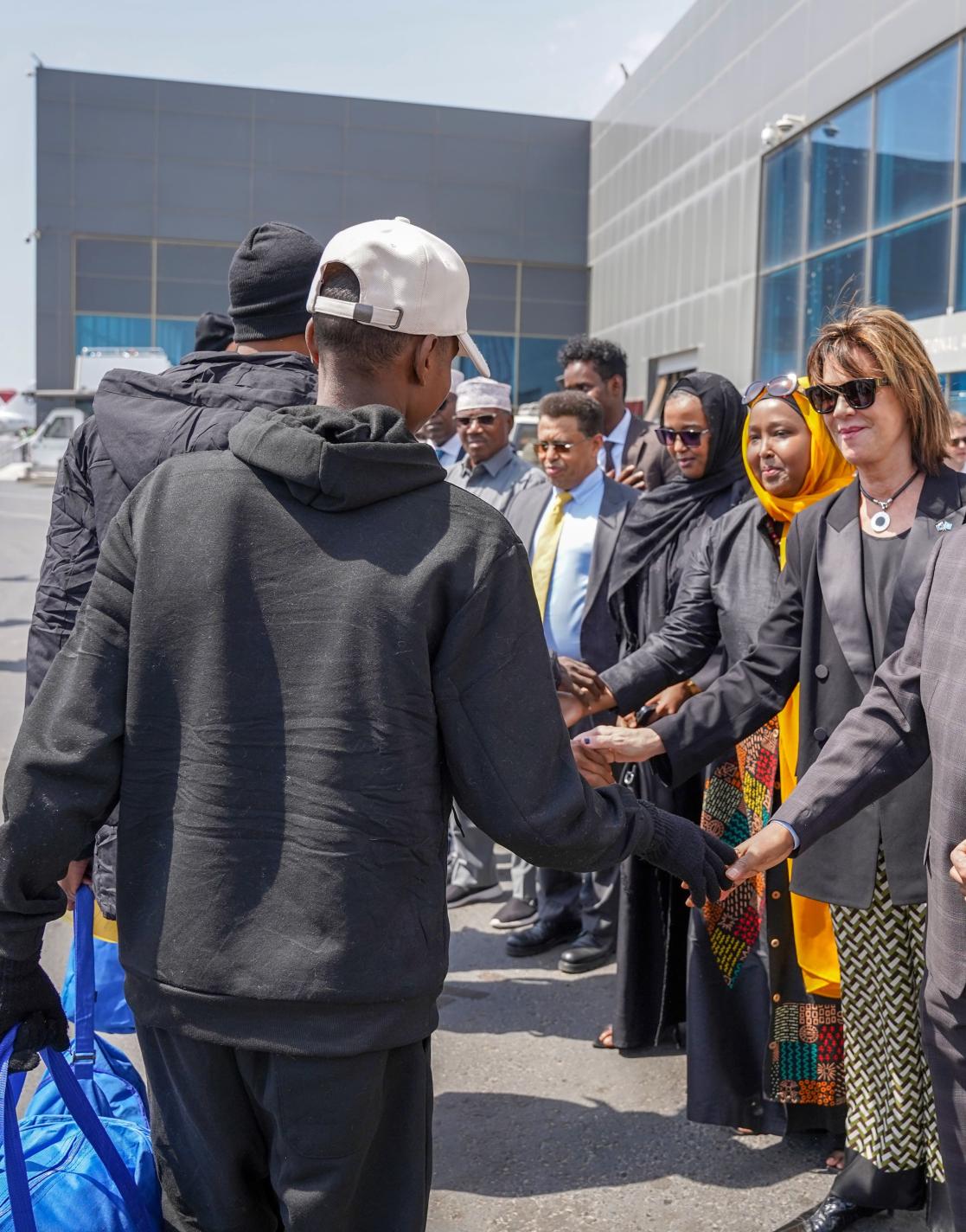 EU Ambassador Karin Johansson welcomes 147 Somali migrants returning from Libya through the EU-funded MPRR-SSA project.