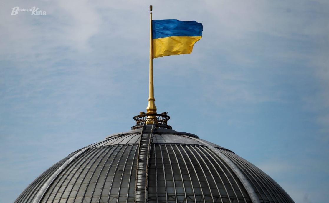 The Ukranian flag on top of the building of the Verkhovna Rada of Ukraine.