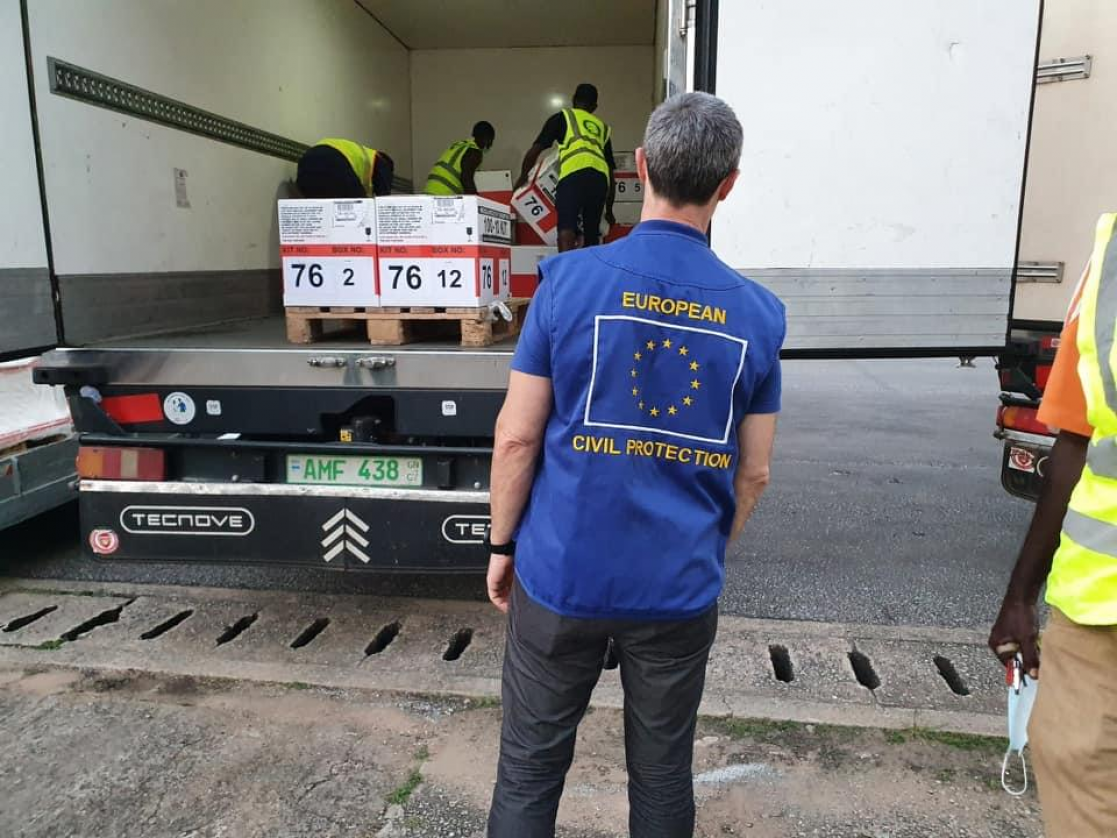 Man checking how a truck is unloaded