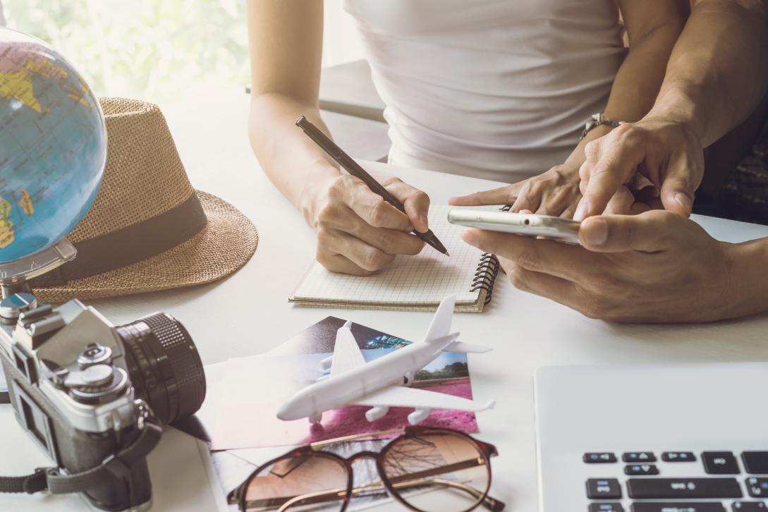 Young couple planning vacation trip