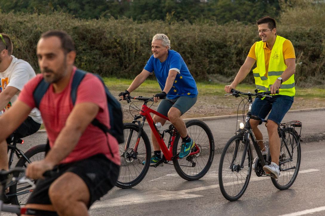 Ambassador Johann Sattler riding a bike with citizens during the Criticalmass ride through Podgorica