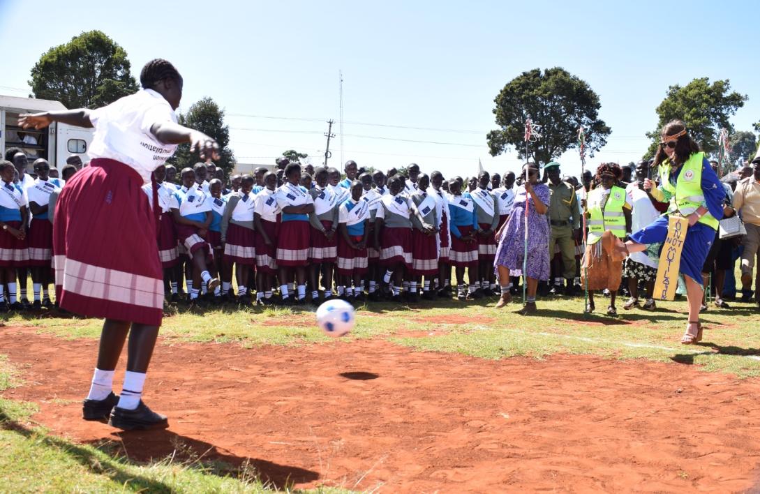 EU Ambassador Henriette Geiger kicks the ball to signify kicking FGM out of Elgeyo Marakwet