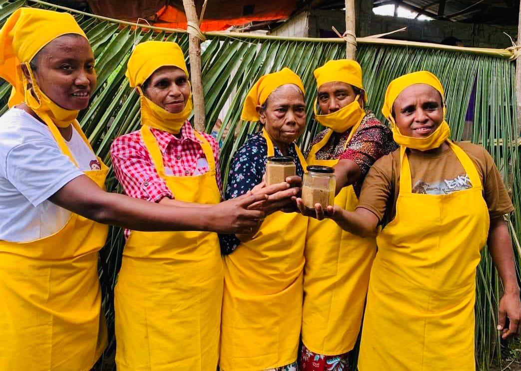 A group of women actively producing local marmelade 