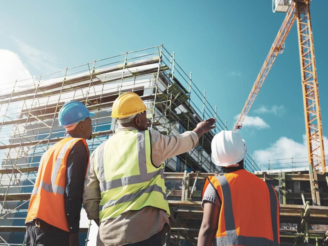 Construction chiefs supervising a site. 