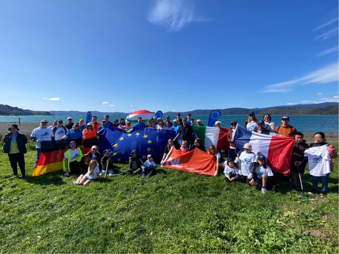 A group of EU delegation and EU Member State Embassies' staff on a beach