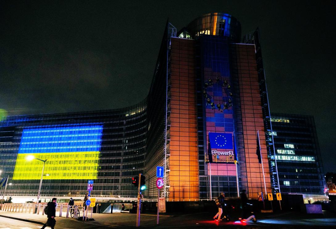 The Ukrainian flag is projected on the side of the European Commission headquarters.