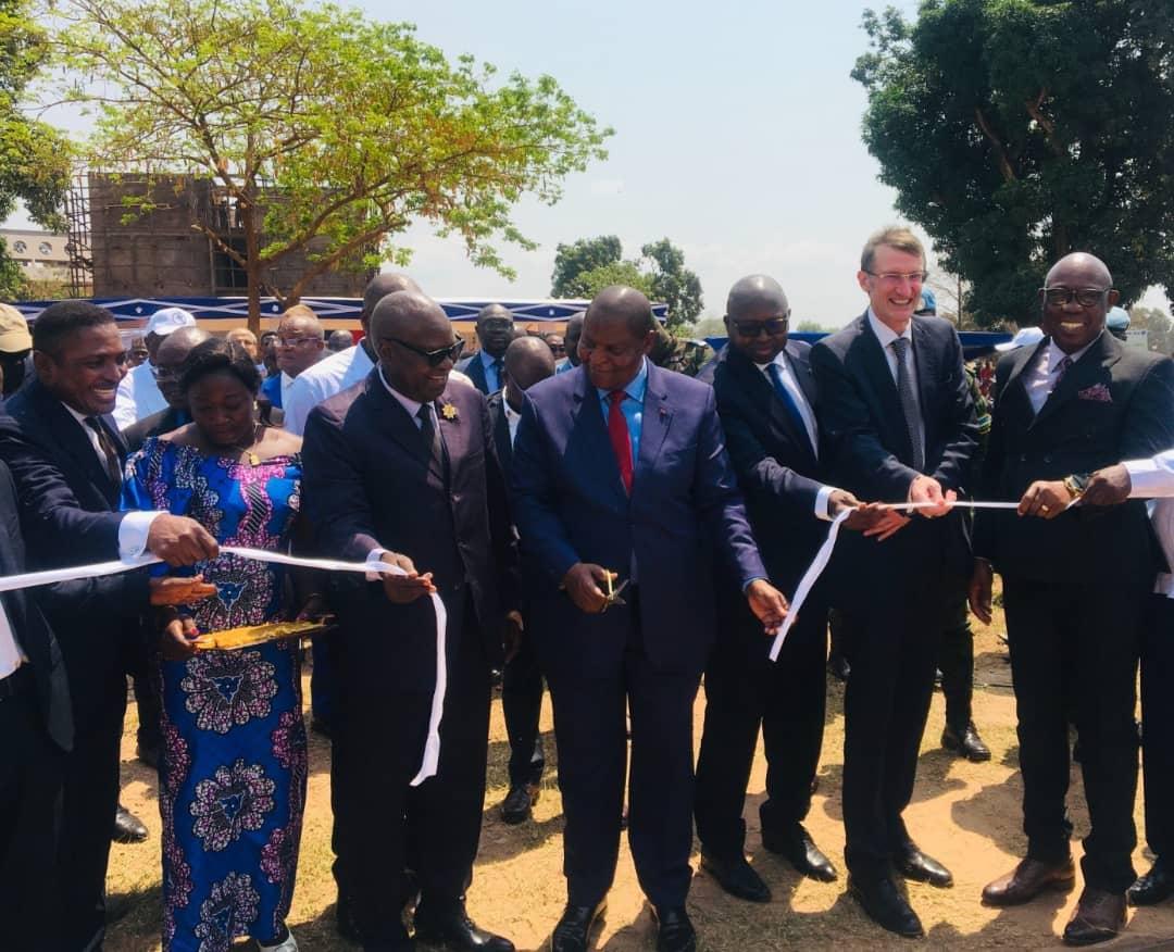 Group of people cutting an inauguration ribbon