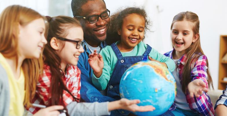 Dad and girls with globe